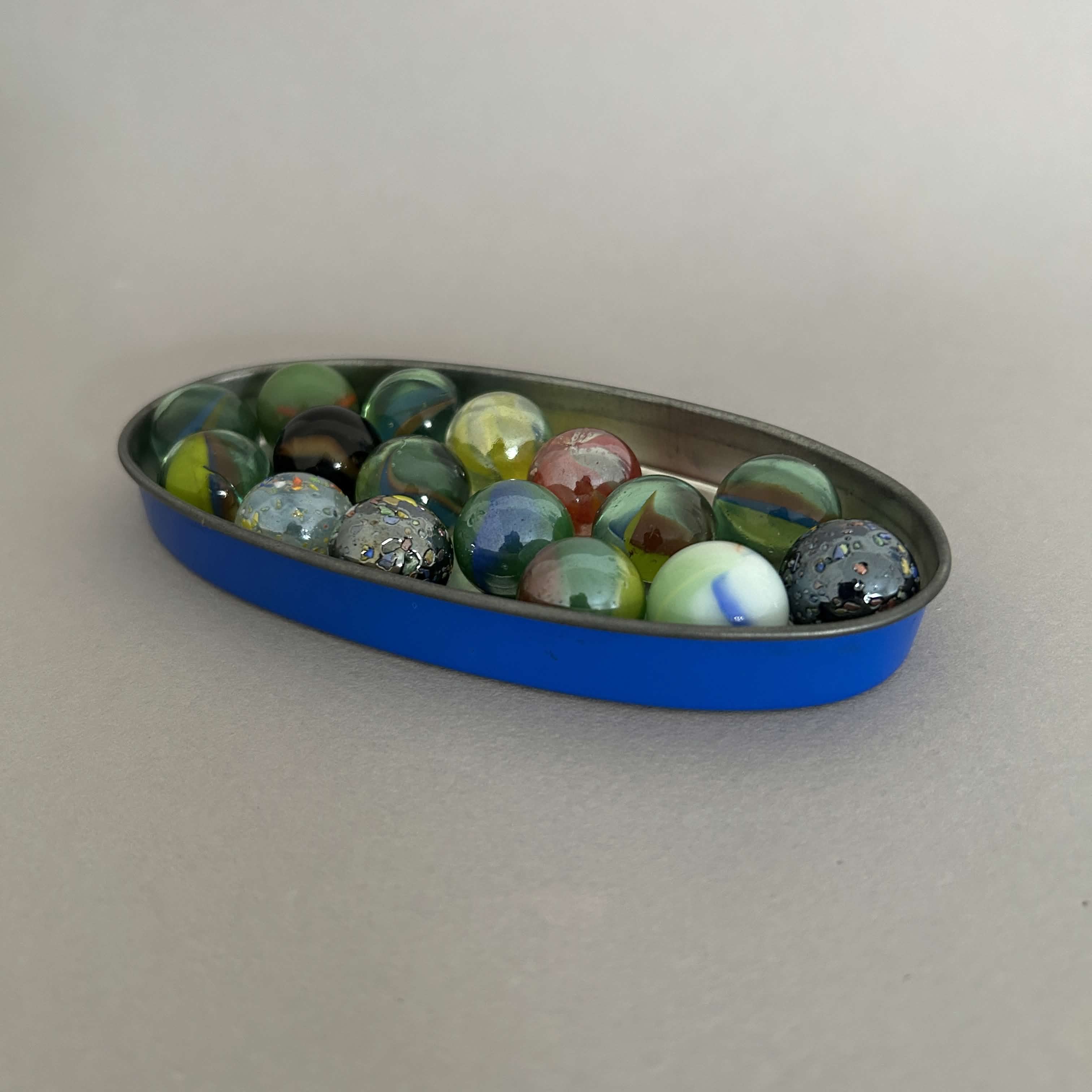 Dumping marbles on a hardwood floor