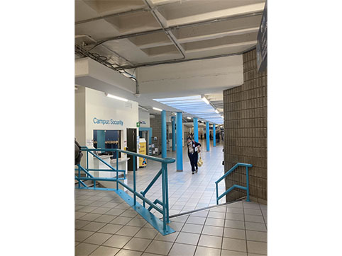 Stairs on in front of the bookstore and campus security. Ramp is only on the other side of the campus security 