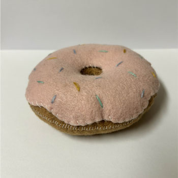 A felt donut pin cushion.