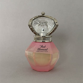 A hexagonal prism glass bottle with clean, sharp edges, giving it a modern and elegant appearance.